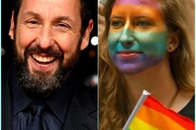 LATEST NEWS: Comedy legend Adam Sandler sent shockwaves through the entertainment world when, just hours before a major prime-time performance, he flat-out refused to wear a pride-colored guitar strap that producers had prepared as a gesture of LGBTQ solidarity. Instead, Adam Sandler delivered a fiery statement denouncing what he called the “woke agenda,” vowing he would never be forced to wear symbols he didn’t believe in — a move that instantly divided fans across Hollywood, Nashville, and the nation.