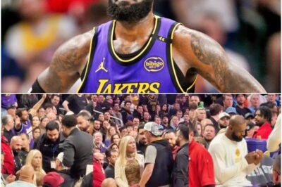 LeBron James Gets Courtside Female Fan Ejected After Heated Exchange, Then Casually Proceeds To Do The Oddest Thing 👑🏀😳It was a tense courtside blow-up, then a swift ejection — and the arena thought the drama was over. Instead, LeBron flipped the whole moment on its head with a bizarre, almost too-calm move right after, leaving the crowd buzzing and the clip racing across the internet.K