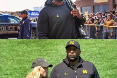 Incriminating Live Tv Footage Resurfaces Of Sherrone Moore Chilling On The Sideline With His Mistress😳📺🔥Old live-tv clips are crashing back into the spotlight, showing Sherrone Moore looking way too relaxed on the sideline next to the woman now outed as his mistress. The resurfaced footage is racing around social media, turning a quiet moment on the bench into the latest smoking gun in a scandal that just won’t die.k